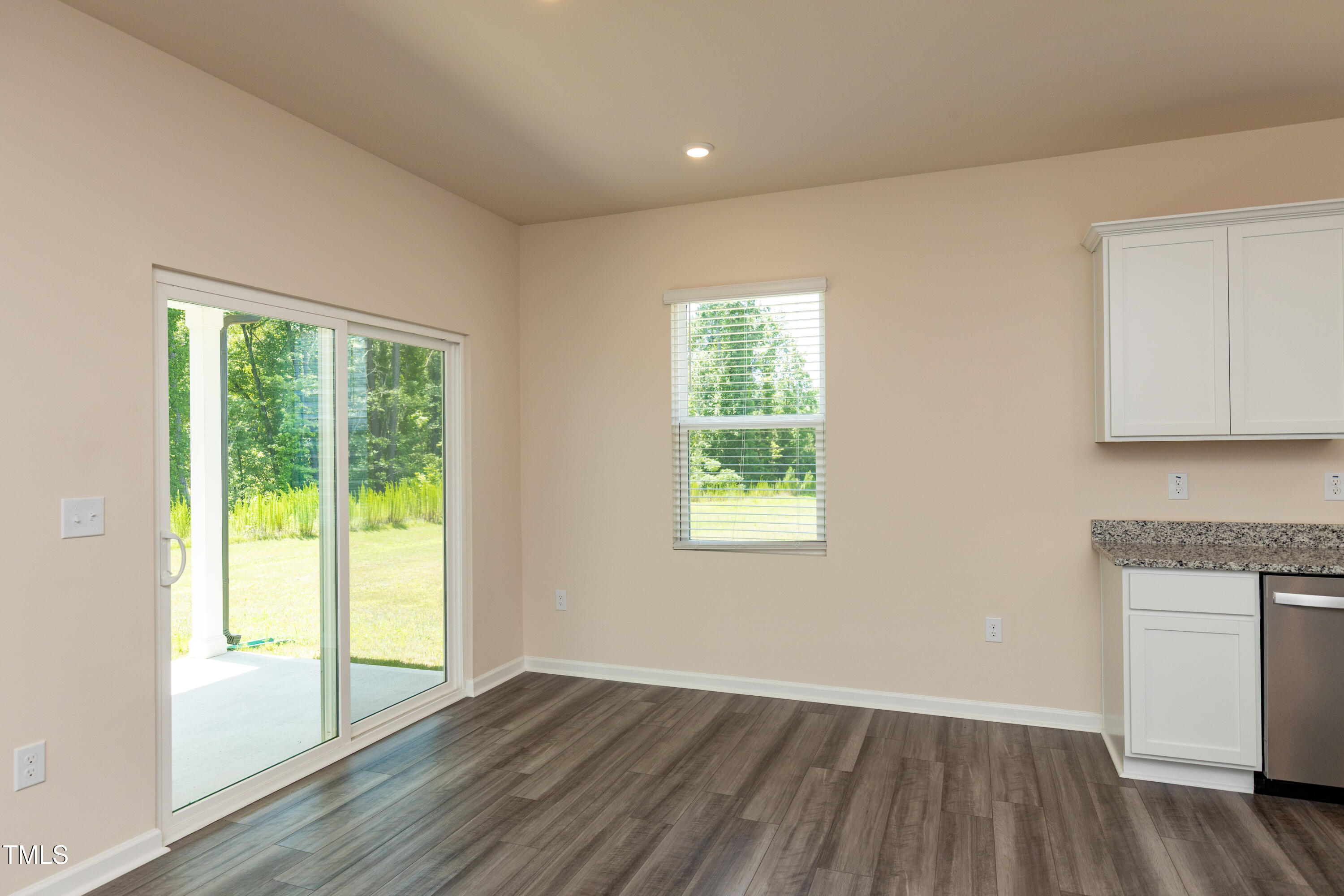 1444 Heron Pond Street Raleigh, NC 27604 - Photo 9 of 37 an empty room with wooden floor and windows