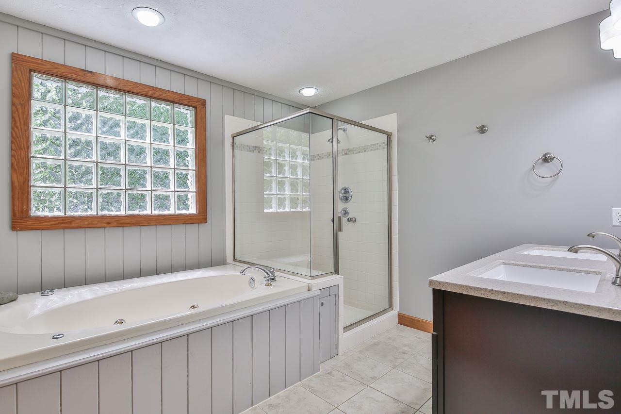 508 Ridge View Pittsboro, NC 27312 - Photo 11 of 30 Spacious garden tub and separate shower. NEW cabinet with top and sinks.