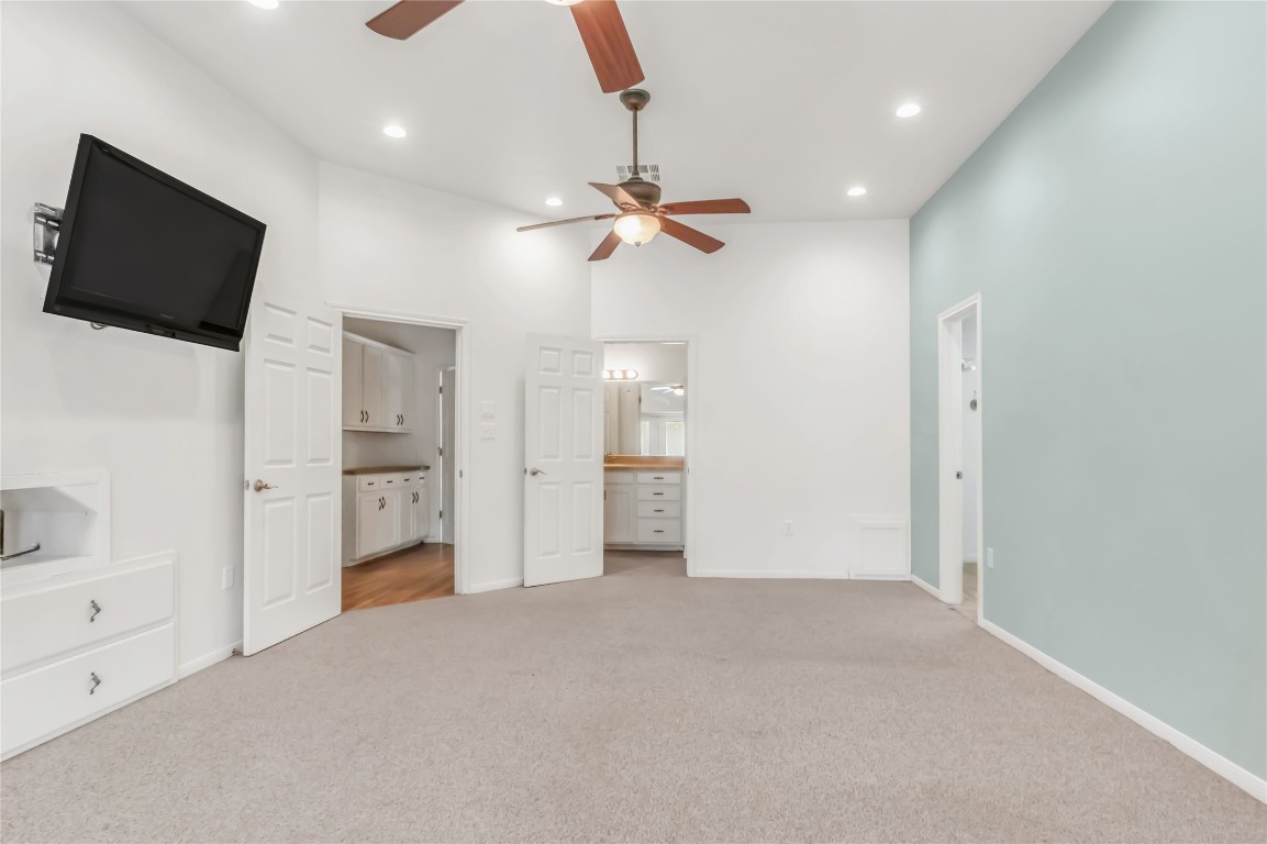 1004 22 Hills Road Gause, TX 77857 - Photo 12 of 40 wooden floor in an empty room with a cabinet and a flat screen tv