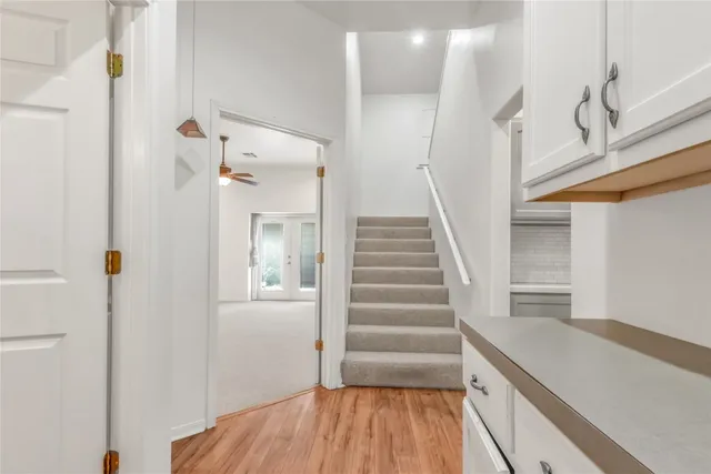 a kitchen with a refrigerator and a counter top space