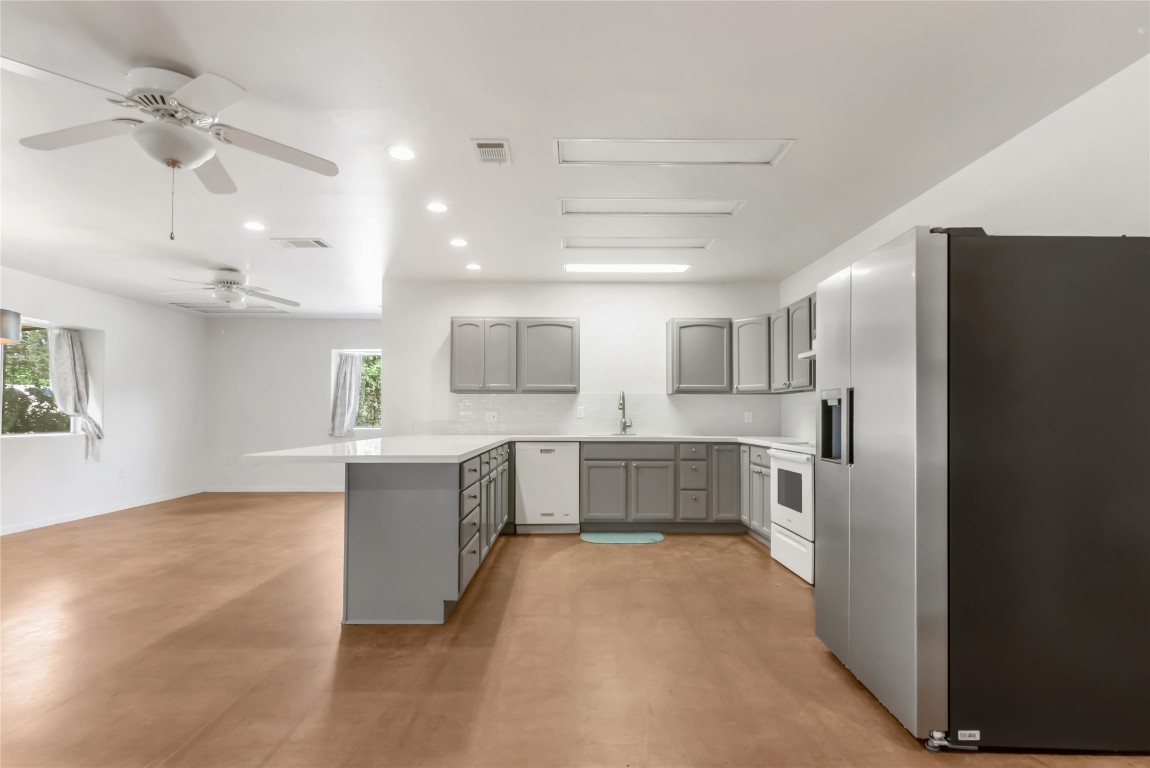 1004 22 Hills Road Gause, TX 77857 - Photo 15 of 40 a kitchen with a refrigerator and a counter top space