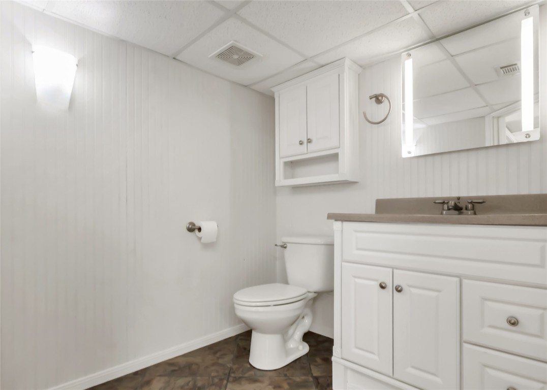 1004 22 Hills Road Gause, TX 77857 - Photo 20 of 40 a bathroom with a toilet a sink and mirror