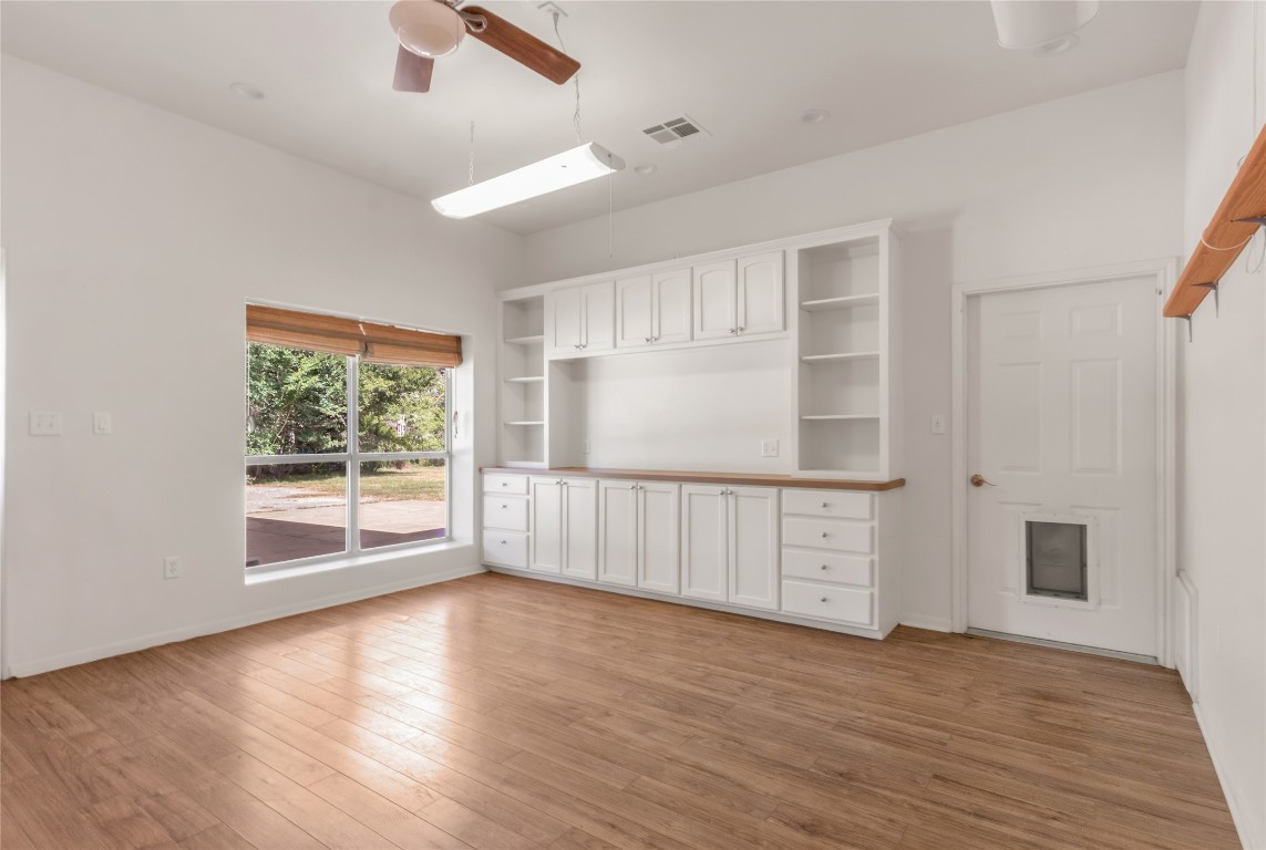 1004 22 Hills Road Gause, TX 77857 - Photo 31 of 40 an empty room with wooden floor and windows