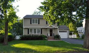 10 Bennett Street Rye, NY 10580 - Photo 1 of 1 a front view of a house with a garden