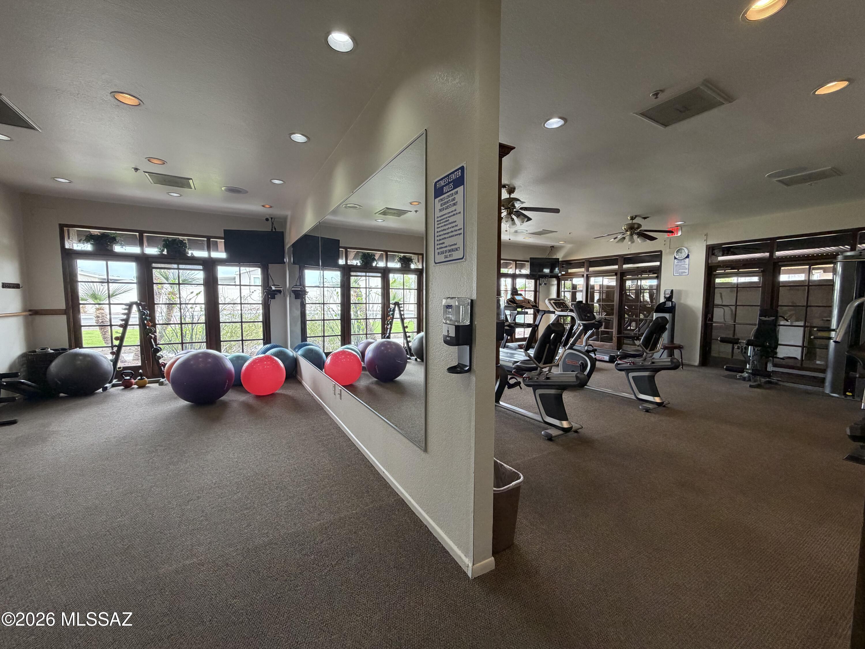 8401 South Kolb Road, Unit 168 Tucson, AZ 85756 - Photo 16 of 20 a view of a room with gym equipment and large windows