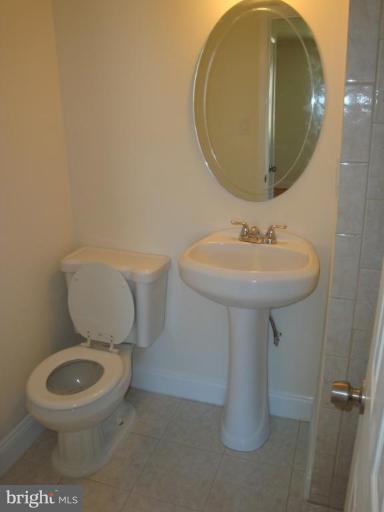 3702 Stonesboro Road Fort Washington, MD 20744 - Photo 7 of 8 a bathroom with a toilet sink and mirror