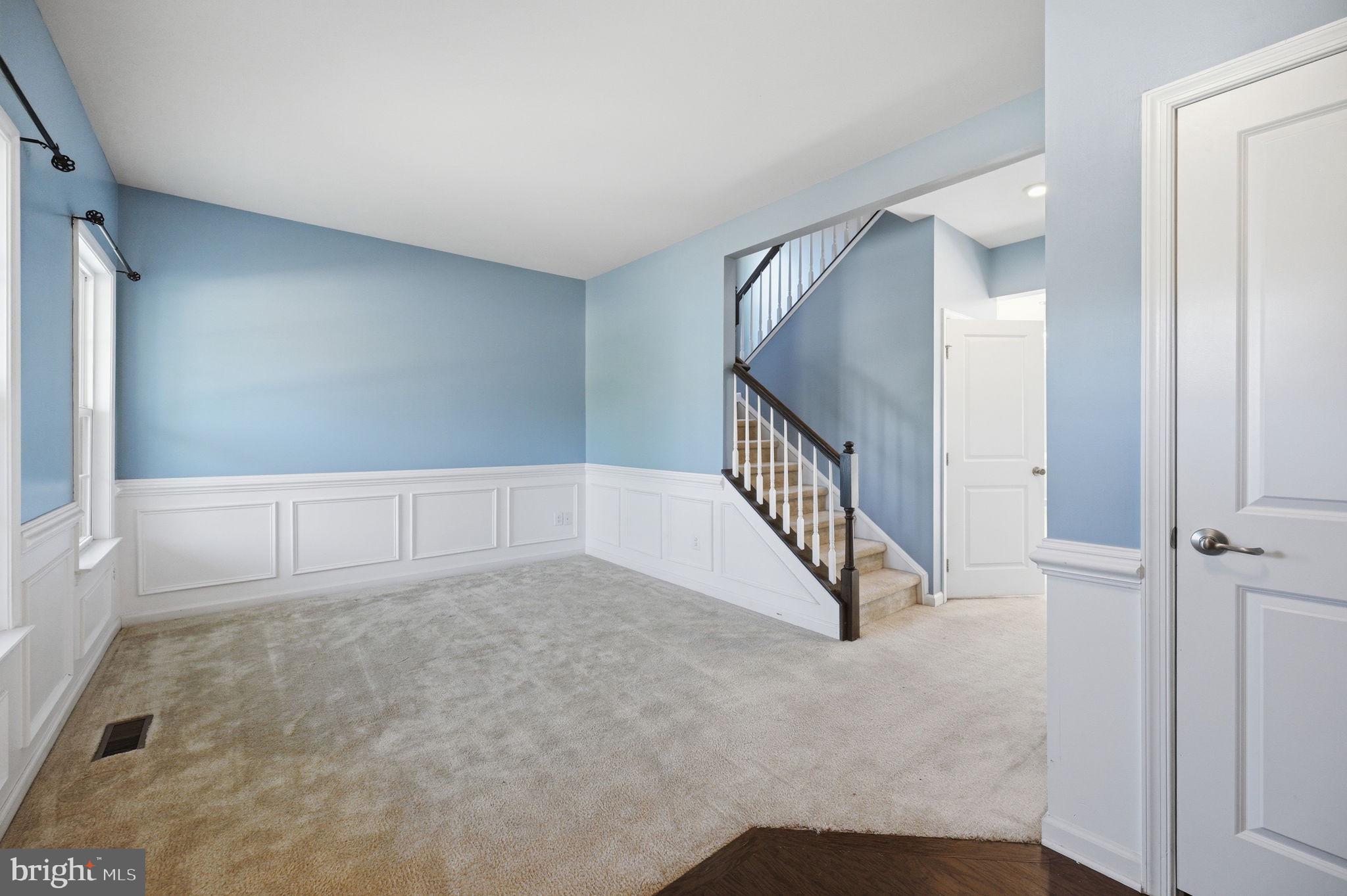687 Blossom Tree Road Culpeper, VA 22701 - Photo 3 of 31 a view of an empty room with stairs