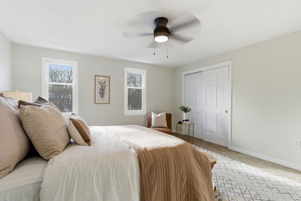 80 Swan Street, Unit 223 Lowell, MA 01852 - Photo 11 of 20 a bedroom with a bed and a window