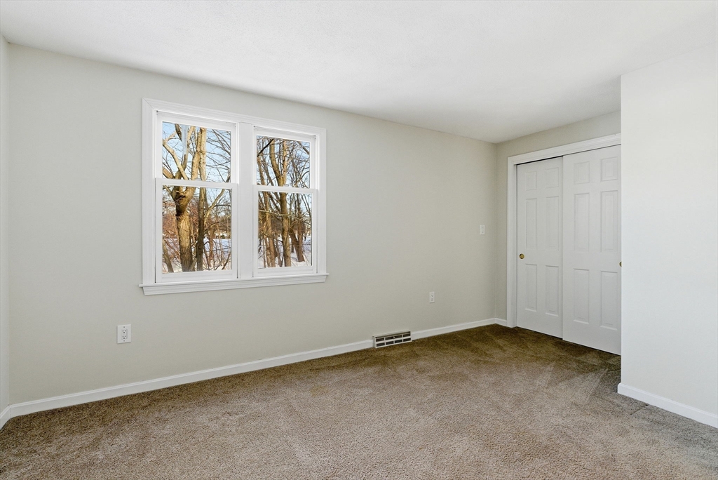 80 Swan Street, Unit 223 Lowell, MA 01852 - Photo 12 of 20 a view of an empty room with a window