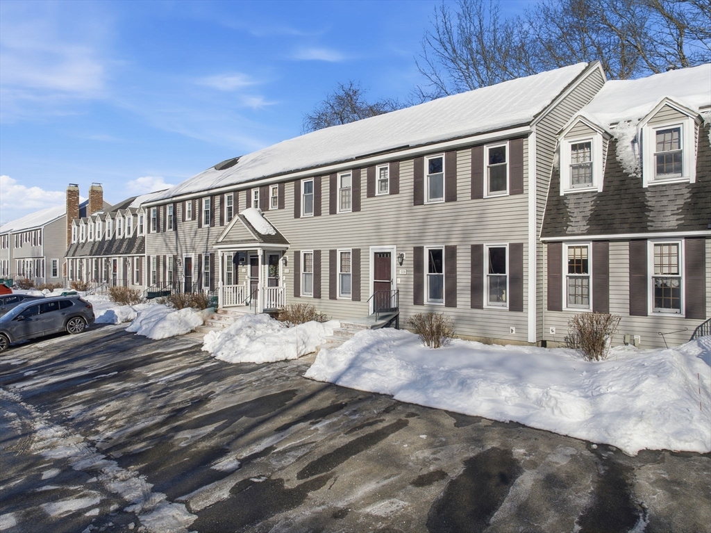 80 Swan Street, Unit 223 Lowell, MA 01852 - Photo 19 of 20 a front view of a house with a yard
