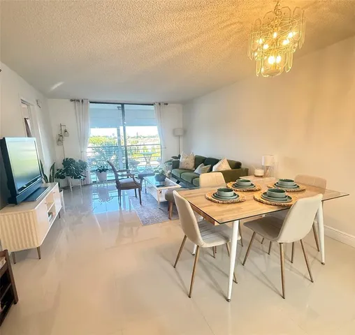 a view of a dining room with furniture window and outside view