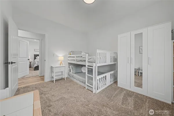 a view of a livingroom with furniture and staircase