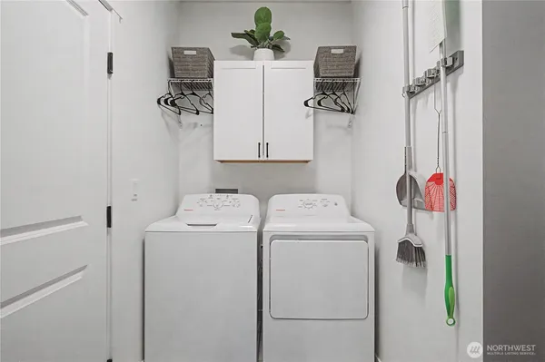 a utility room with dryer and washer