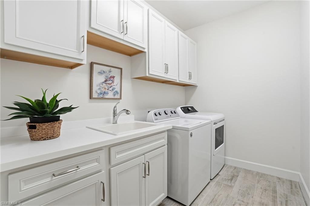 17210 Ashcomb Way Estero, FL 33928 - Photo 31 of 47 a view of cabinets with wooden floor
