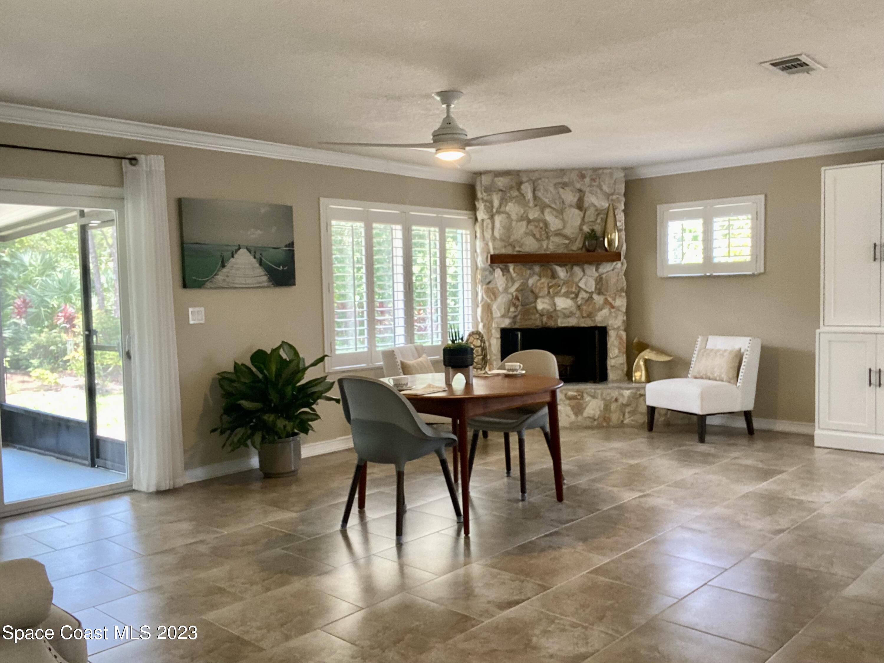 2900 Pine Branch Drive Melbourne, FL 32940 - Photo 16 of 48 a view of a livingroom with furniture and a potted plant