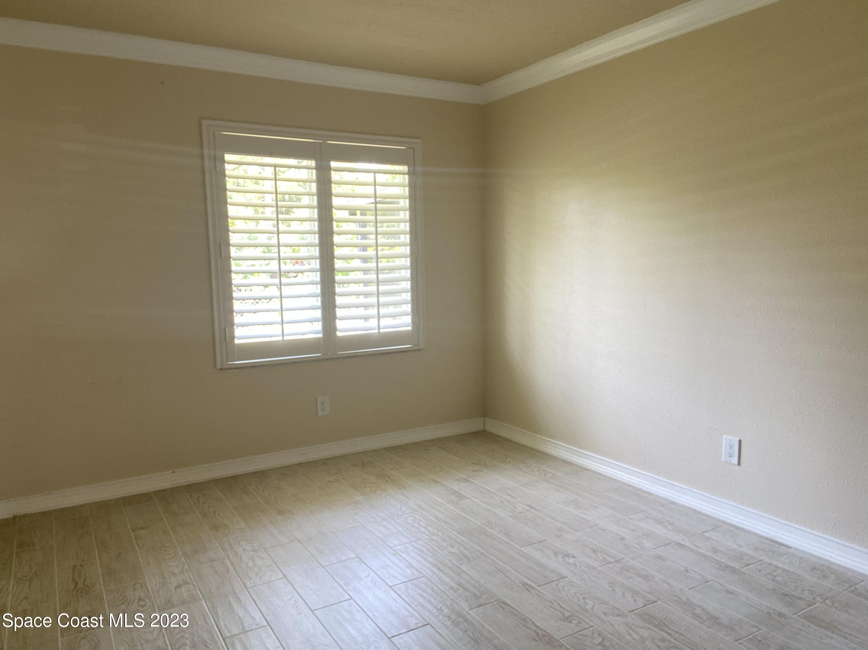 2900 Pine Branch Drive Melbourne, FL 32940 - Photo 23 of 48 a view of an empty room with a window