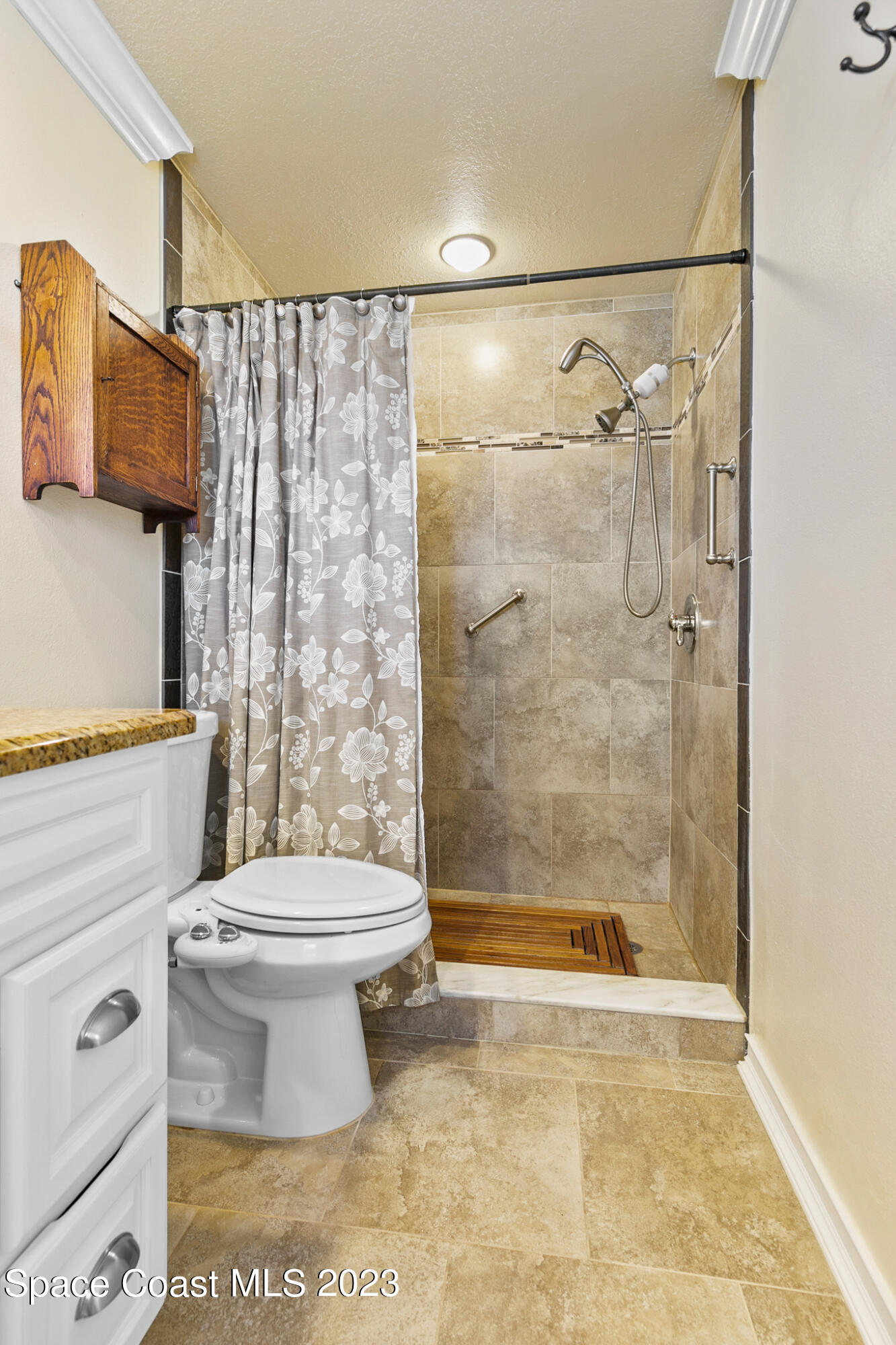 2900 Pine Branch Drive Melbourne, FL 32940 - Photo 27 of 48 a bathroom with a toilet and a shower