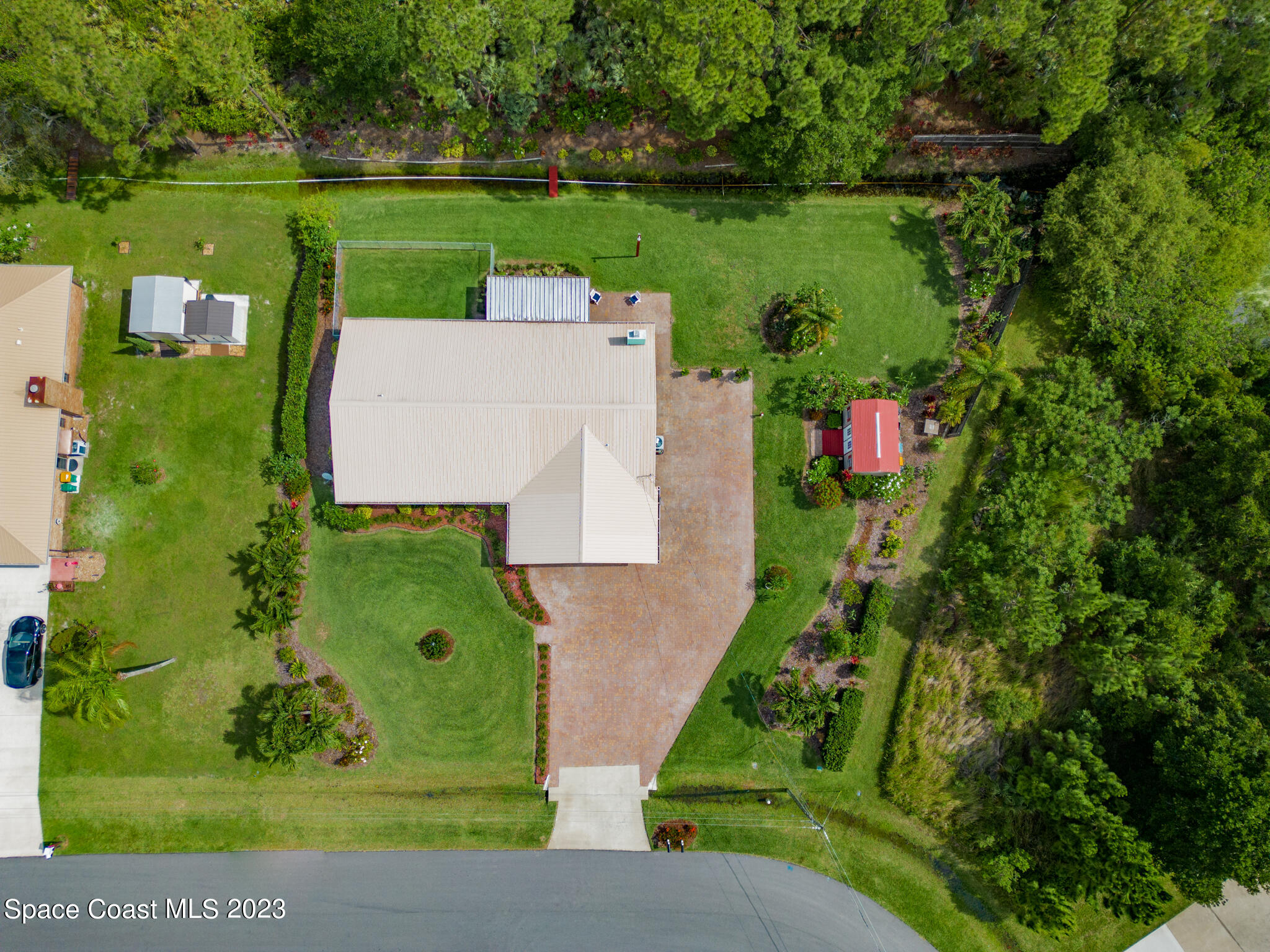 2900 Pine Branch Drive Melbourne, FL 32940 - Photo 43 of 48 an aerial view of a house with a yard and lake view