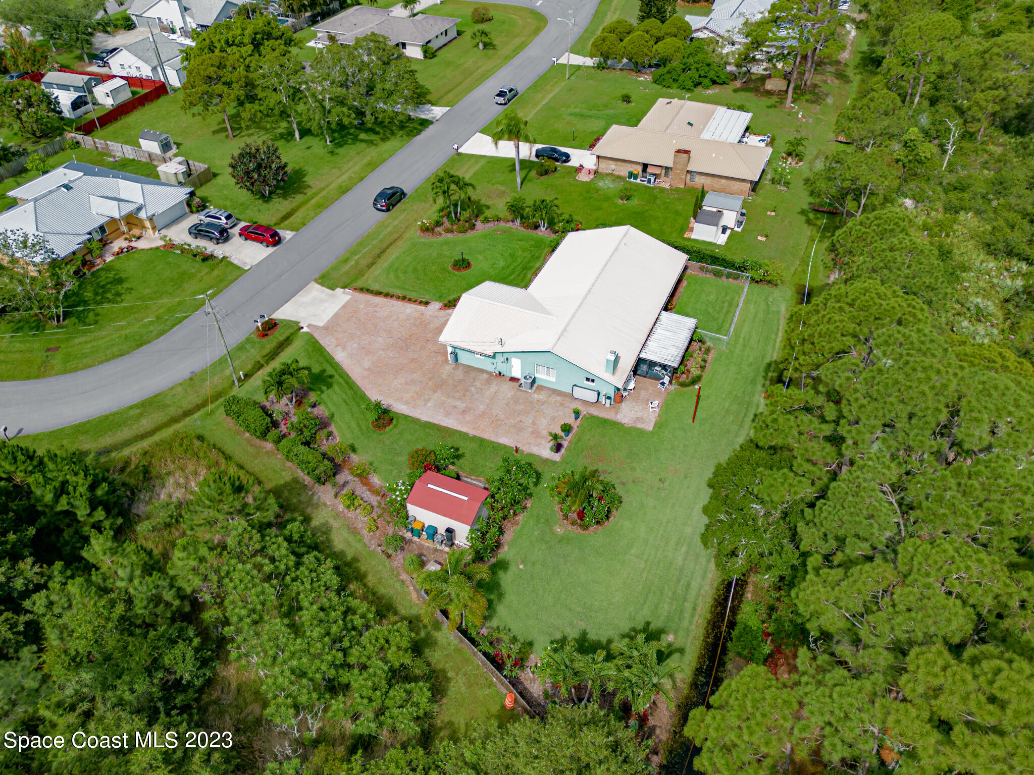 2900 Pine Branch Drive Melbourne, FL 32940 - Photo 46 of 48 an aerial view of a house with a garden and yard