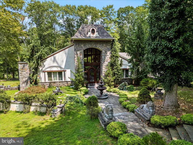 an aerial view of a house with yard swimming pool and outdoor seating