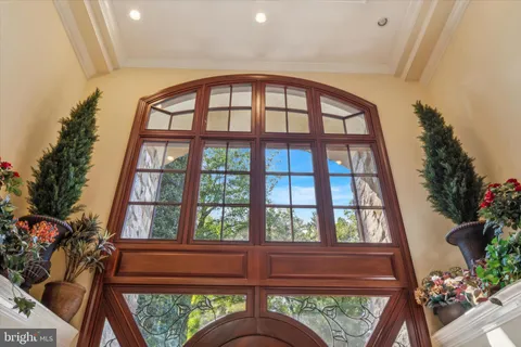 a bedroom with furniture and a potted plant