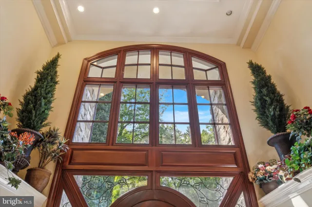 a bedroom with furniture and a potted plant