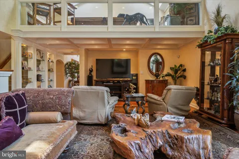 an aerial view of residential houses with outdoor space and lake view