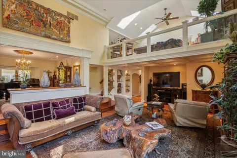 an aerial view of residential houses with outdoor space and lake view