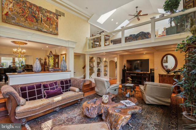 an aerial view of residential houses with outdoor space and lake view