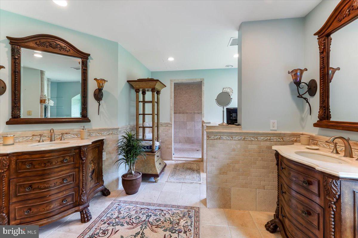 134 Springton Lake Road Media, PA 19063 - Photo 62 of 99 a bathroom with a double vanity sink and a mirror
