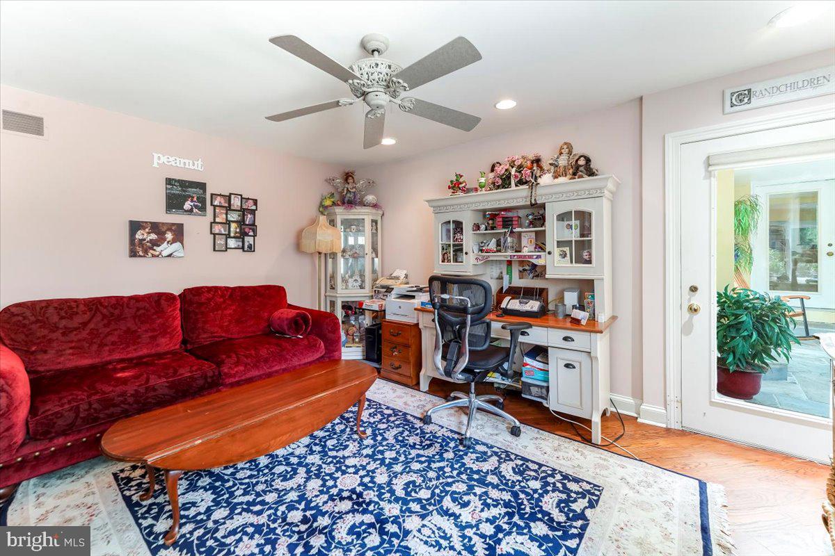 134 Springton Lake Road Media, PA 19063 - Photo 67 of 99 a living room with lots of furniture and wooden floor