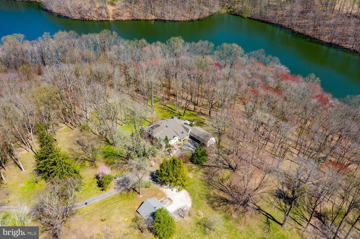 134 Springton Lake Road Media, PA 19063 - Photo 73 of 99 a view of a lake with a yard and large trees