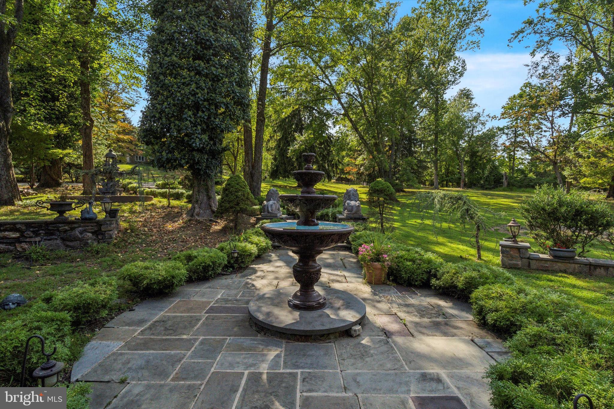 134 Springton Lake Road Media, PA 19063 - Photo 97 of 99 a view of a fountain in the yard with large trees