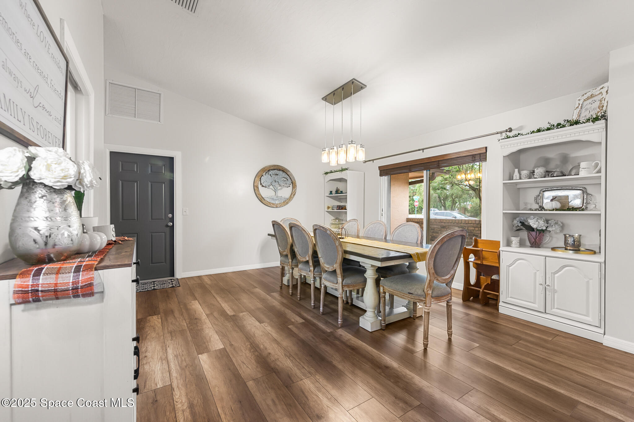 3700 Red Duck Place Melbourne, FL 32934 - Photo 12 of 47 a view of a dining room with furniture window and wooden floor