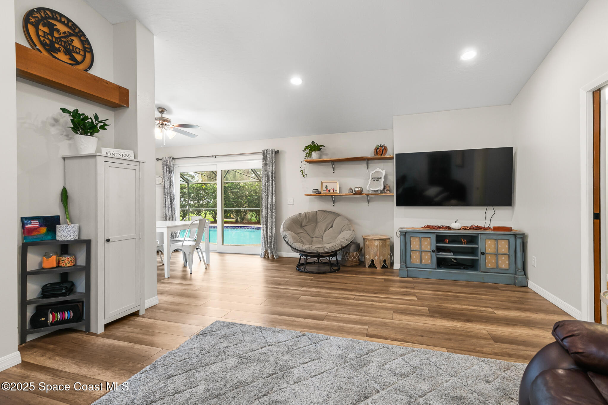 3700 Red Duck Place Melbourne, FL 32934 - Photo 17 of 47 a living room with furniture and a flat screen tv