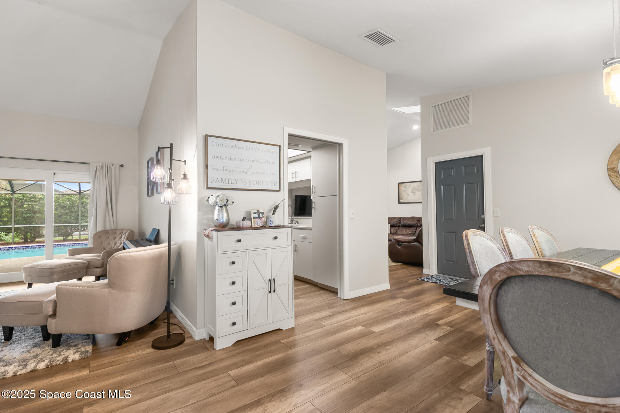 3700 Red Duck Place Melbourne, FL 32934 - Photo 18 of 47 a living room with furniture a window and a dresser