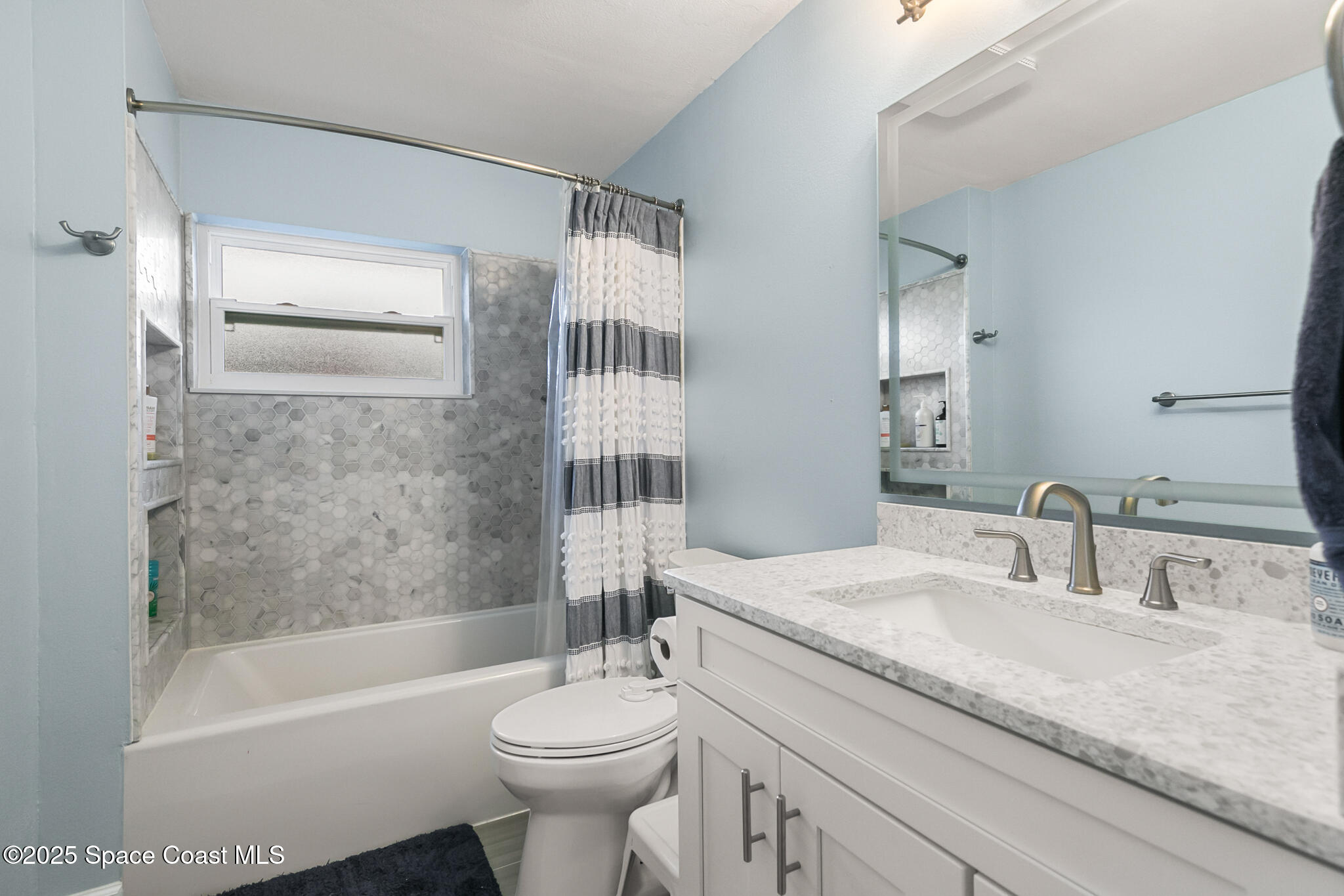 3700 Red Duck Place Melbourne, FL 32934 - Photo 29 of 47 a bathroom with a sink a toilet and shower