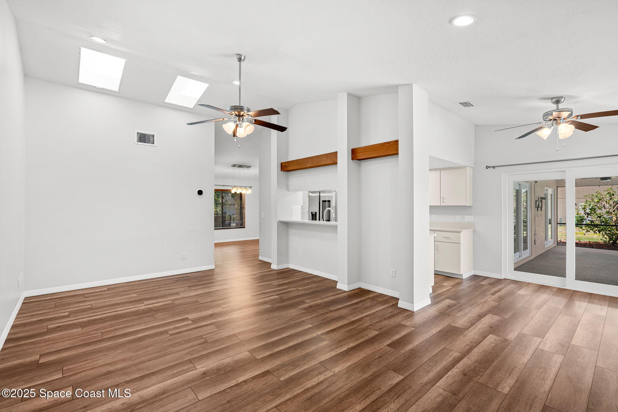 3700 Red Duck Place Melbourne, FL 32934 - Photo 37 of 47 a view of a livingroom with wooden floor and a ceiling fan