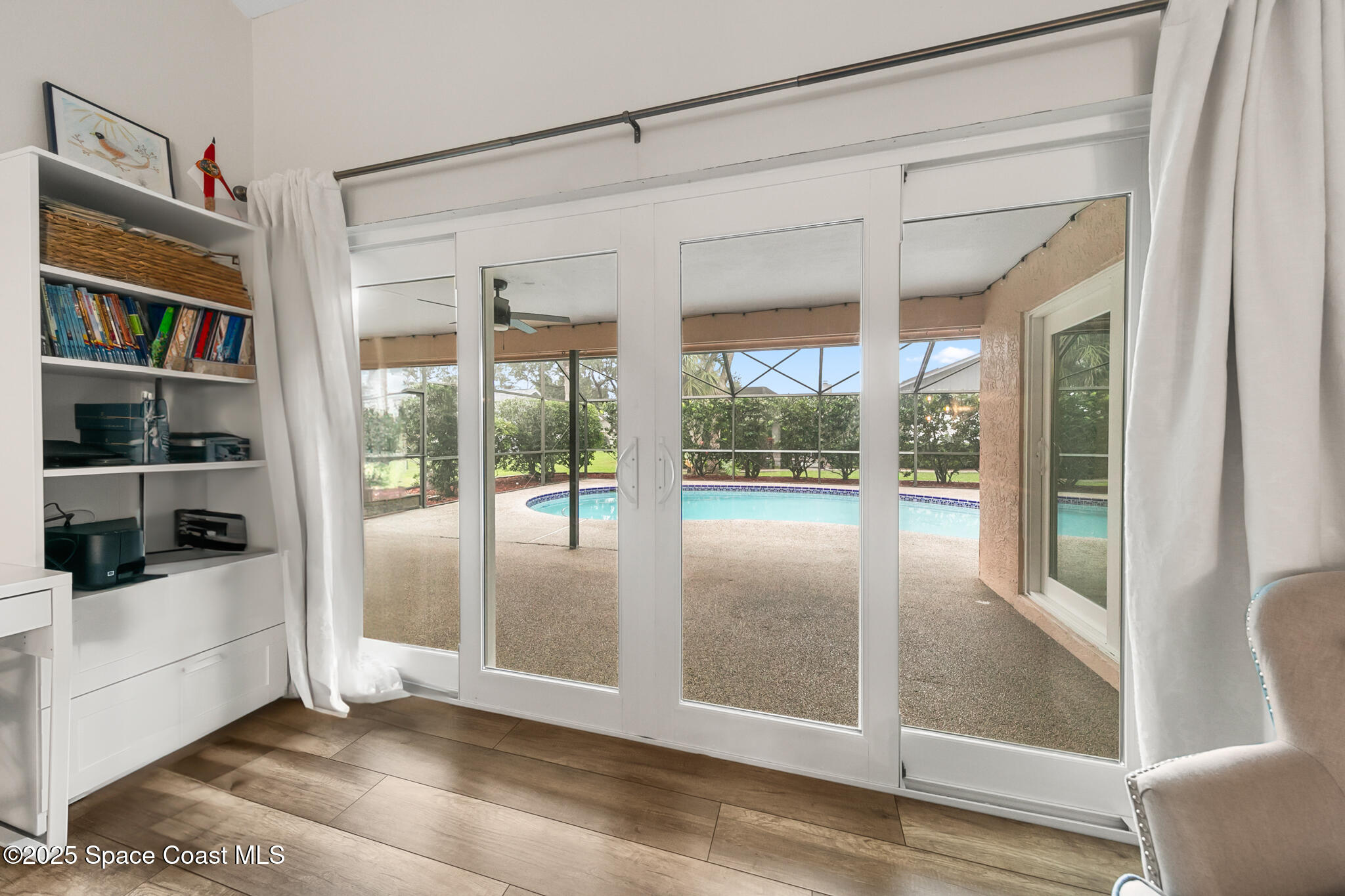 3700 Red Duck Place Melbourne, FL 32934 - Photo 9 of 47 a view of a big room with wooden floor and windows