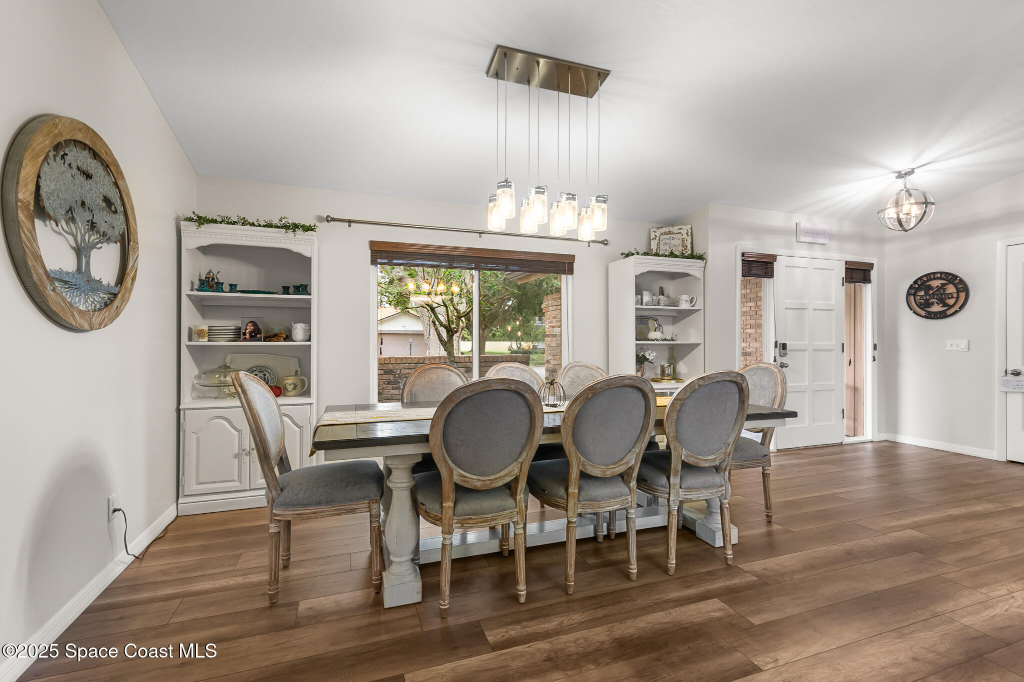 3700 Red Duck Place Melbourne, FL 32934 - Photo 10 of 47 a dining room with furniture a rug and wooden floor