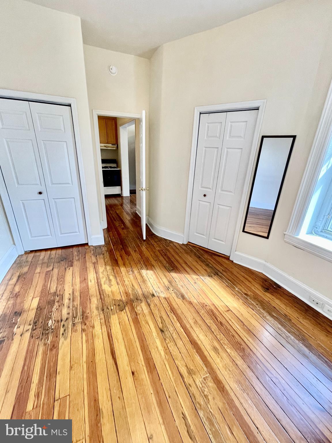 253 Hansberry Street, Unit 1F Philadelphia, PA 19144 - Photo 13 of 20 a view of empty room with wooden floor