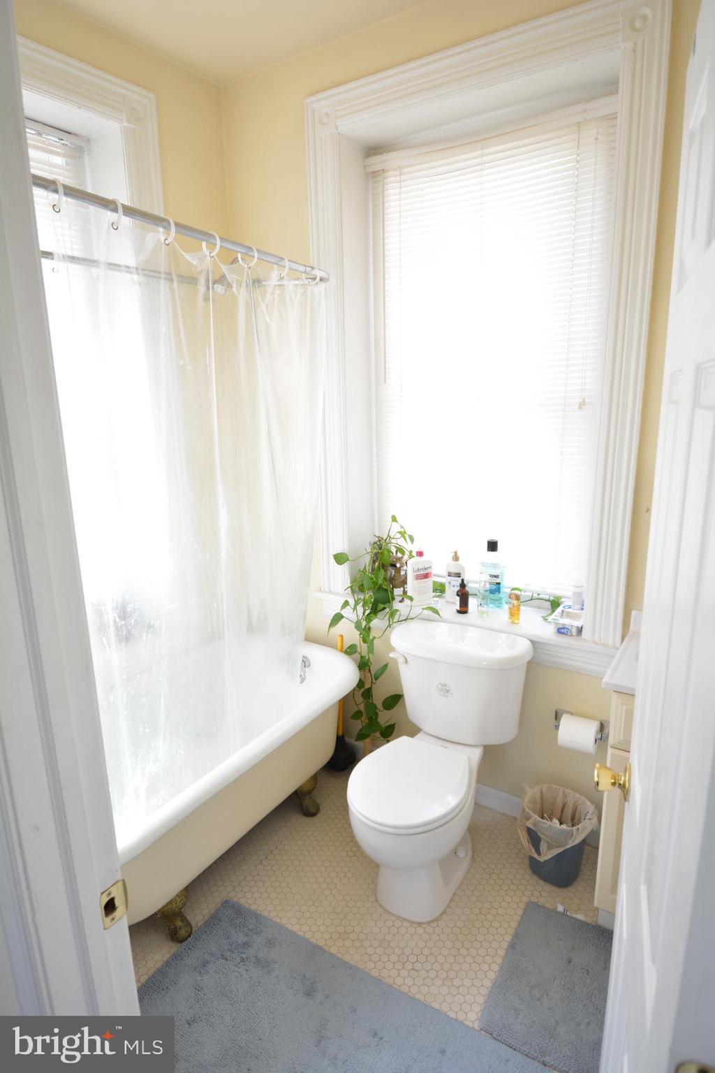 253 Hansberry Street, Unit 1F Philadelphia, PA 19144 - Photo 18 of 20 a bathroom with a sink toilet and shower