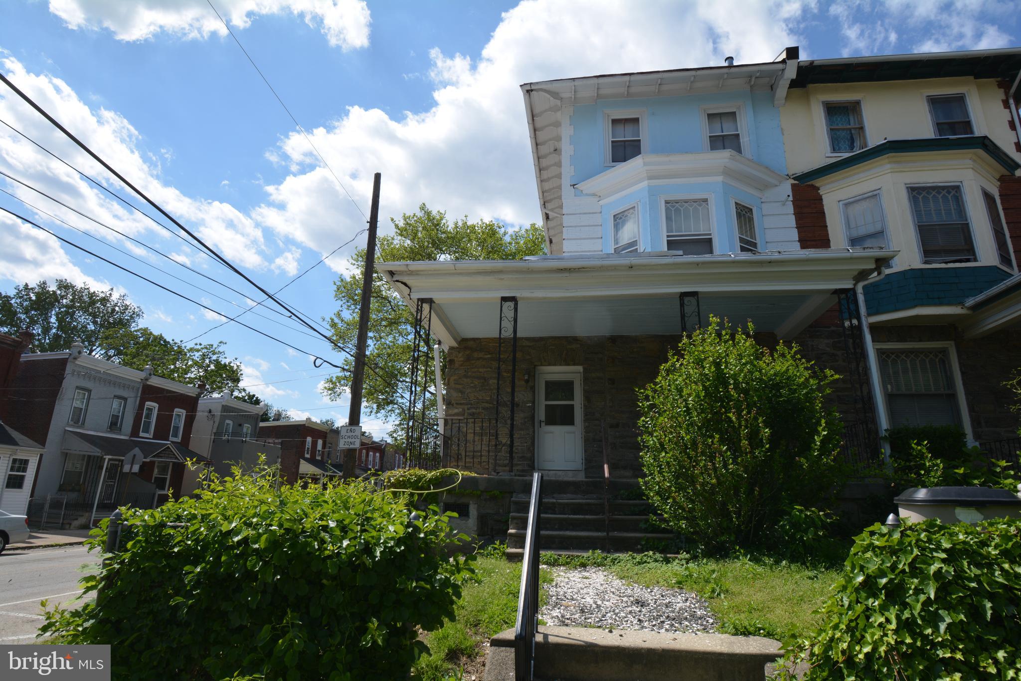 253 Hansberry Street, Unit 1F Philadelphia, PA 19144 - Photo 19 of 20 a view of a house with a garden