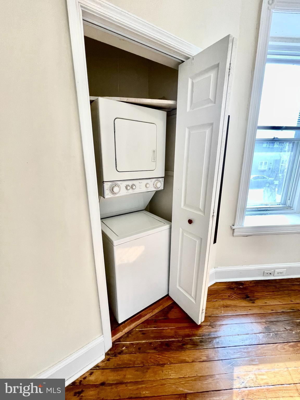 253 Hansberry Street, Unit 1F Philadelphia, PA 19144 - Photo 8 of 20 a utility room with wooden floor washer and dryer