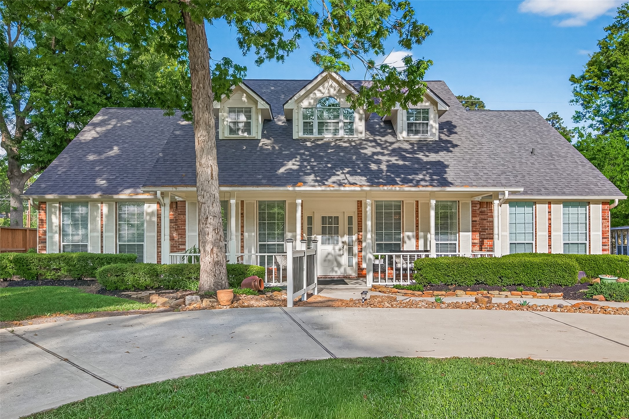522 Beauregard Drive Conroe, TX 77302 - Photo 1 of 50 a front view of a house with a garden