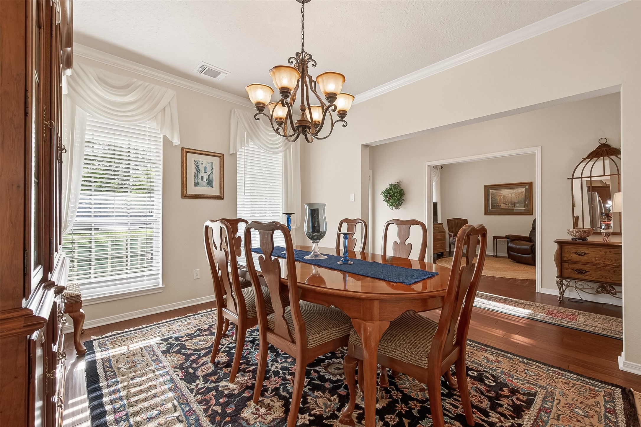 522 Beauregard Drive Conroe, TX 77302 - Photo 11 of 50 a view of a dining room with furniture window and wooden floor