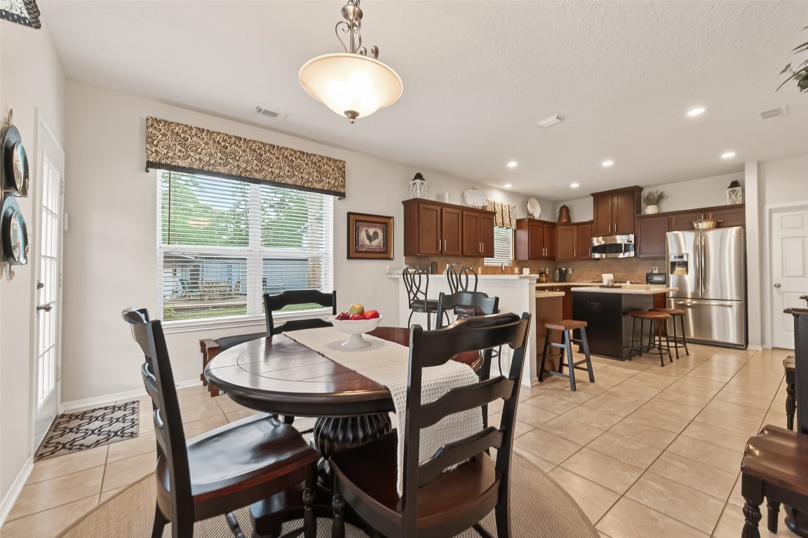 522 Beauregard Drive Conroe, TX 77302 - Photo 14 of 50 a view of a dining room with furniture window and outside view