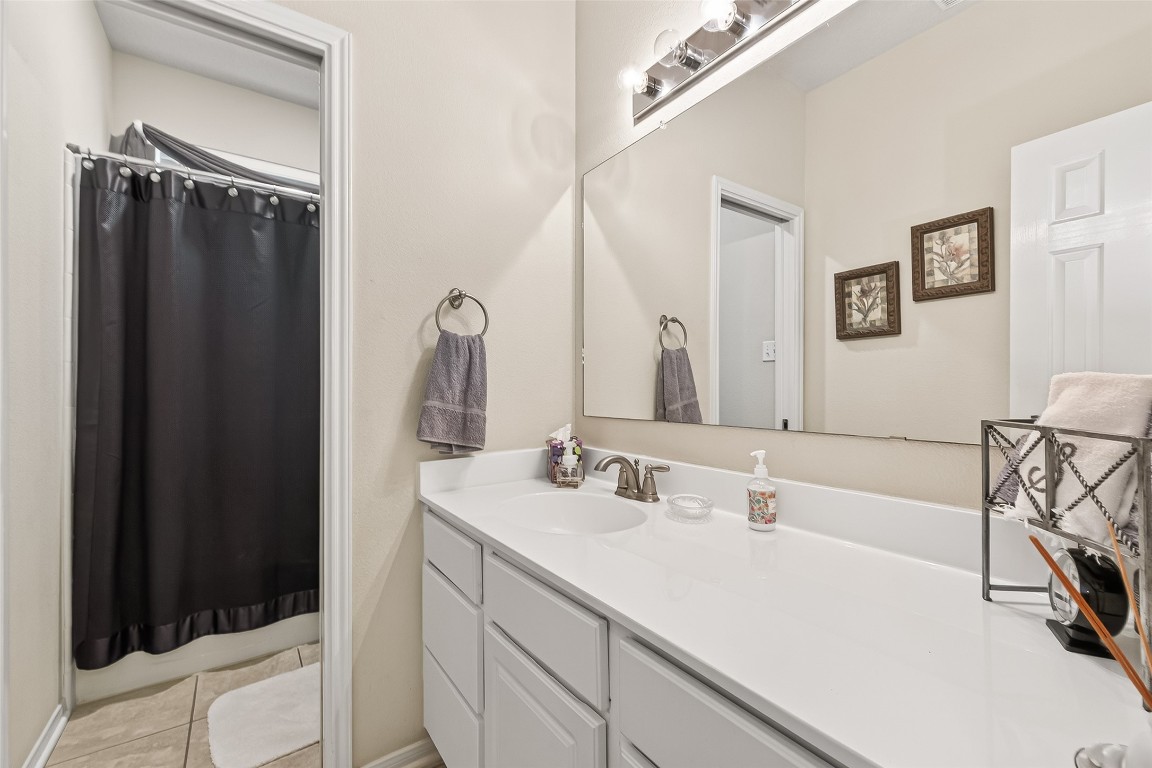 522 Beauregard Drive Conroe, TX 77302 - Photo 28 of 50 a bathroom with a sink and a mirror