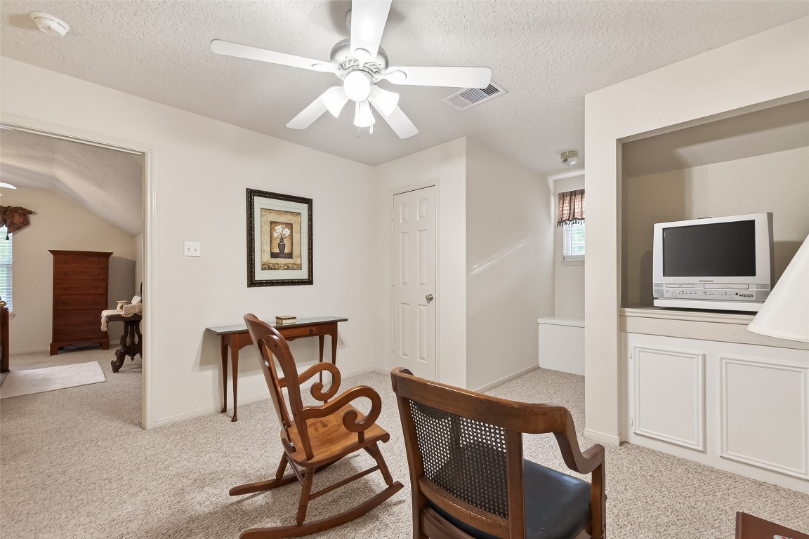 522 Beauregard Drive Conroe, TX 77302 - Photo 35 of 50 a view of a livingroom with furniture and a flat screen tv