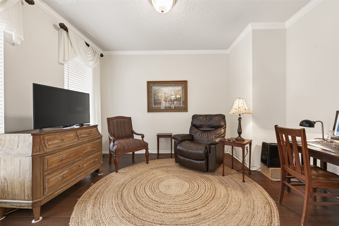 522 Beauregard Drive Conroe, TX 77302 - Photo 9 of 50 a living room with furniture and a flat screen tv